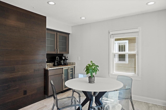 915 E Ohio Ave, Milwaukee, WI 53207 - dining space featuring wine cooler, baseboards, recessed lighting, and light marble finish flooring