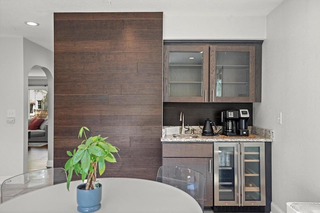 915 E Ohio Ave, Milwaukee, WI 53207 - indoor wet bar with wine cooler, arched walkways, baseboards, and recessed lighting