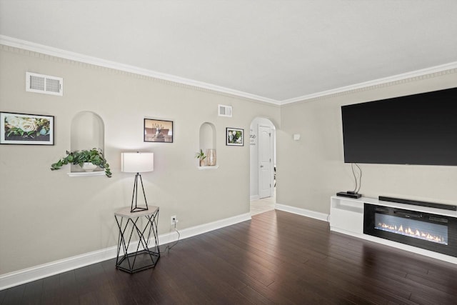 915 E Ohio Ave, Milwaukee, WI 53207 - unfurnished living room featuring arched walkways, baseboards, ornamental molding, and wood finished floors