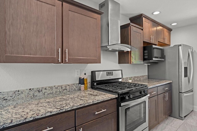 915 E Ohio Ave, Milwaukee, WI 53207 - kitchen with appliances with stainless steel finishes, wall chimney range hood, light stone counters, recessed lighting, and light marble finish floors