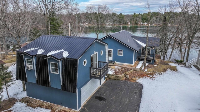 N1416 W Stratton Rd, Waupaca, WI 54981 - view of property exterior featuring a water view, metal roof, and cooling unit