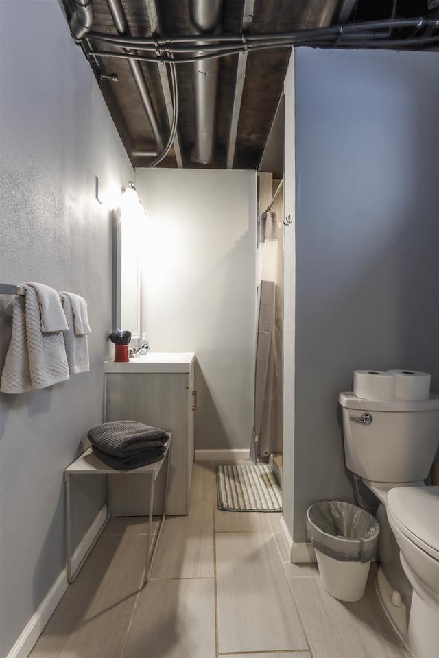 N1416 W Stratton Rd, Waupaca, WI 54981 - full bathroom with toilet, a shower stall, vanity, and baseboards