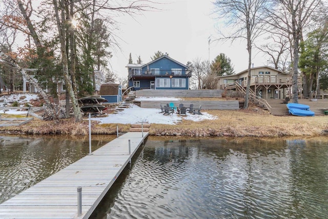 N1416 W Stratton Rd, Waupaca, WI 54981 - dock featuring stairs, a deck with water view, and an outdoor fire pit