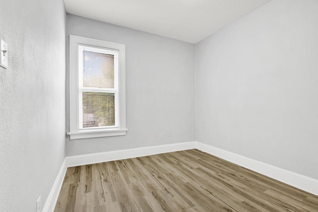 3381 N 26th St Unit 3383, Milwaukee, WI 53206 - spare room with wood finished floors and baseboards