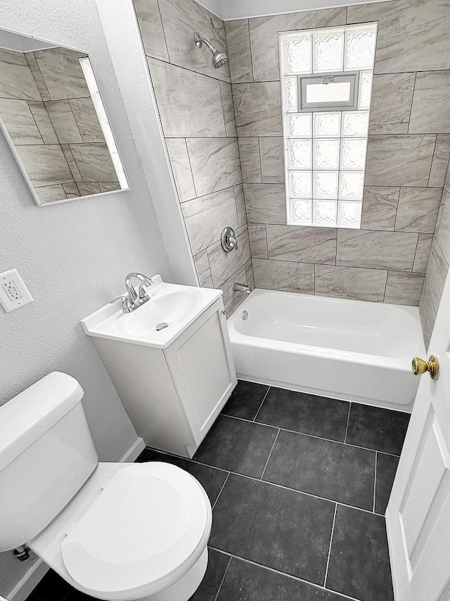3381 N 26th St Unit 3383, Milwaukee, WI 53206 - full bath with toilet,  shower combination, tile patterned flooring, vanity, and a textured wall