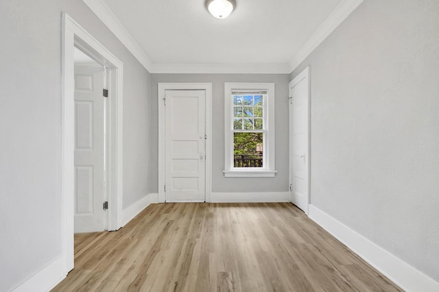 3381 N 26th St Unit 3383, Milwaukee, WI 53206 - entryway featuring light wood-type flooring, ornamental molding, and baseboards