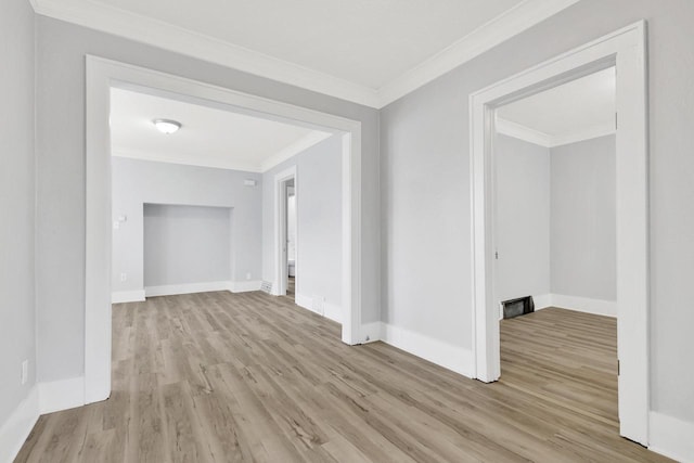 3381 N 26th St Unit 3383, Milwaukee, WI 53206 - empty room featuring wood finished floors, crown molding, and baseboards