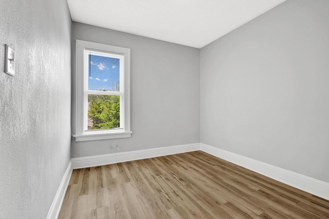 3381 N 26th St Unit 3383, Milwaukee, WI 53206 - empty room featuring wood finished floors and baseboards