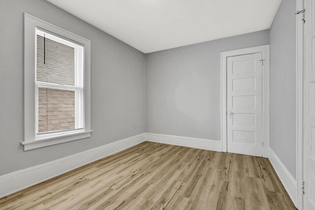3381 N 26th St Unit 3383, Milwaukee, WI 53206 - spare room featuring light wood-style flooring, baseboards, and healthy amount of natural light