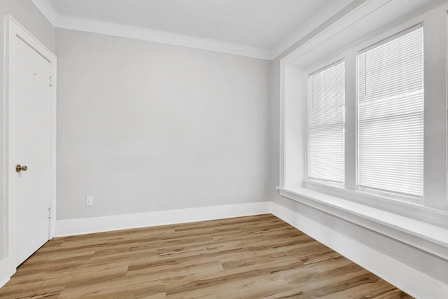 3381 N 26th St Unit 3383, Milwaukee, WI 53206 - empty room with ornamental molding, light wood finished floors, and baseboards