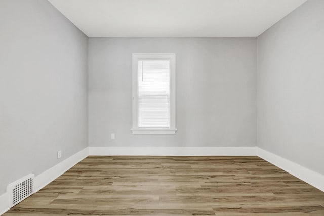 3381 N 26th St Unit 3383, Milwaukee, WI 53206 - spare room featuring wood finished floors and baseboards