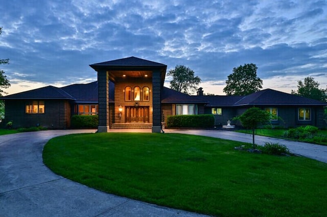 S82W15980 Bass Bay Ln, Muskego, WI 53150 - view of front of home featuring curved driveway and a front yard