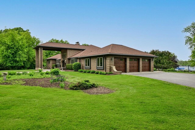 S82W15980 Bass Bay Ln, Muskego, WI 53150 - view of front of property featuring driveway, a chimney, and an attached garage