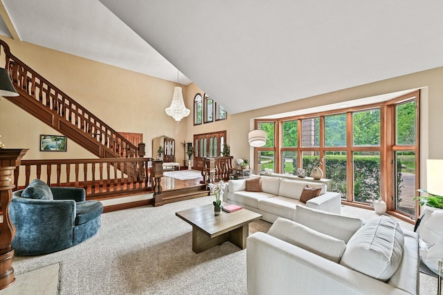 S82W15980 Bass Bay Ln, Muskego, WI 53150 - carpeted living room with high vaulted ceiling, stairway, and arched walkways
