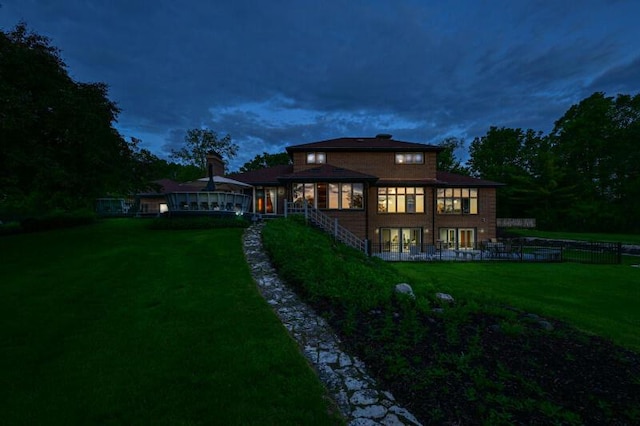 S82W15980 Bass Bay Ln, Muskego, WI 53150 - rear view of house featuring a lawn