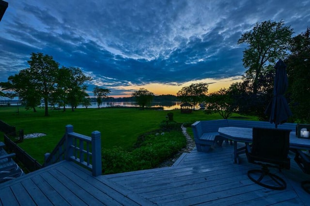 S82W15980 Bass Bay Ln, Muskego, WI 53150 - deck at dusk featuring a water view and a yard