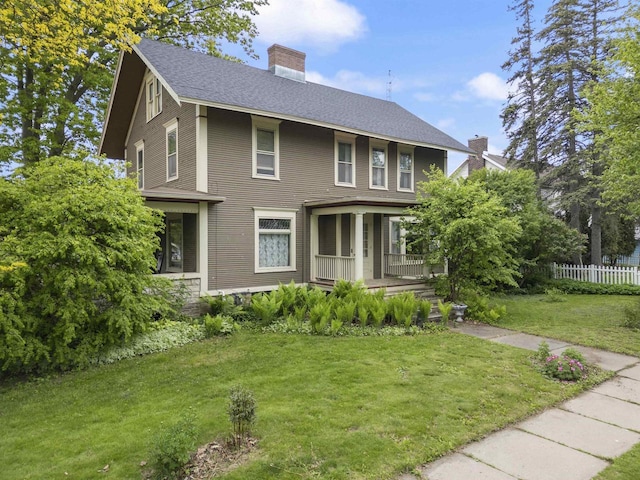 300 S Vine Ave, Marshfield, WI 54449 - view of front of home with a porch, a chimney, and roof with shingles