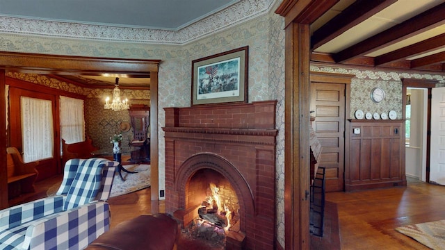 300 S Vine Ave, Marshfield, WI 54449 - living area with wallpapered walls, wood finished floors, a chandelier, and ornamental molding