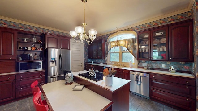 300 S Vine Ave, Marshfield, WI 54449 - kitchen with stainless steel appliances, reddish brown cabinets, a chandelier, light countertops, and glass insert cabinets