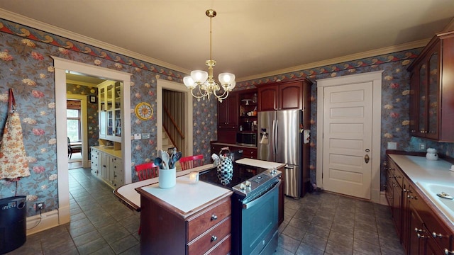 300 S Vine Ave, Marshfield, WI 54449 - kitchen featuring stainless steel appliances, a chandelier, wallpapered walls, light countertops, and crown molding
