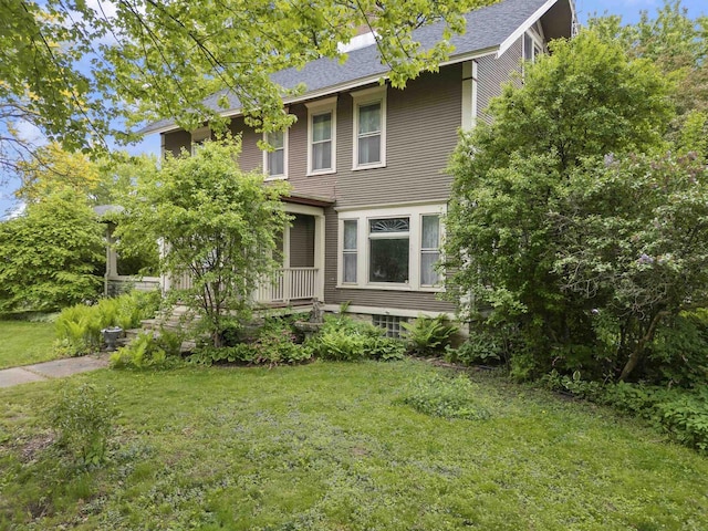 300 S Vine Ave, Marshfield, WI 54449 - view of front facade featuring a front lawn and a shingled roof