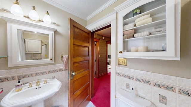 300 S Vine Ave, Marshfield, WI 54449 - bathroom featuring a sink, tile walls, ornamental molding, wainscoting, and toilet