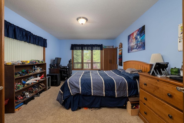 N1440 Red Oaks Dr, La Crosse, WI 54601 - carpeted bedroom with a desk and a textured ceiling