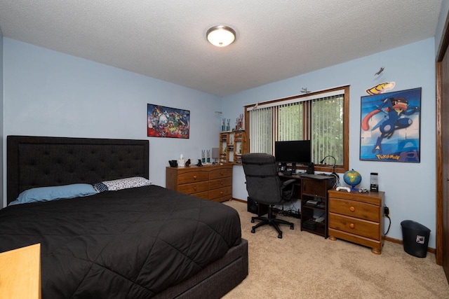 N1440 Red Oaks Dr, La Crosse, WI 54601 - carpeted bedroom featuring a textured ceiling, a desk, and baseboards