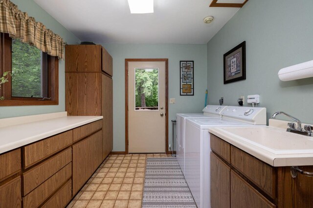 N1440 Red Oaks Dr, La Crosse, WI 54601 - laundry room with cabinet space and washer and clothes dryer