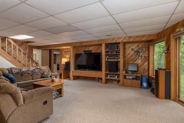 N1440 Red Oaks Dr, La Crosse, WI 54601 - living area with wood walls, carpet flooring, stairs, and a paneled ceiling