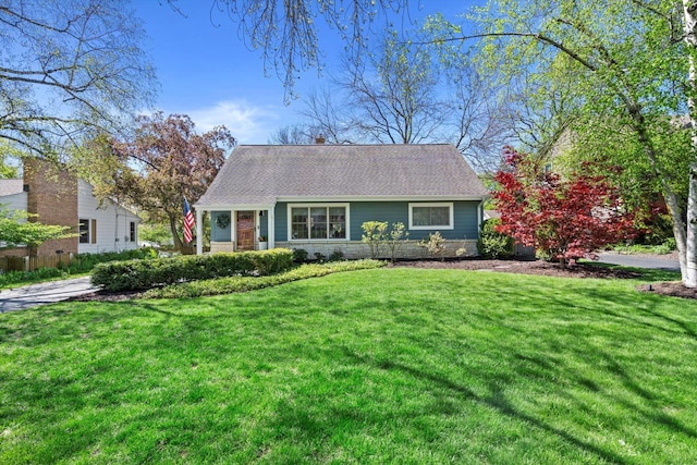 415 E Willow Rd, Fox Point, WI 53217 - view of front of property with a front lawn and a shingled roof