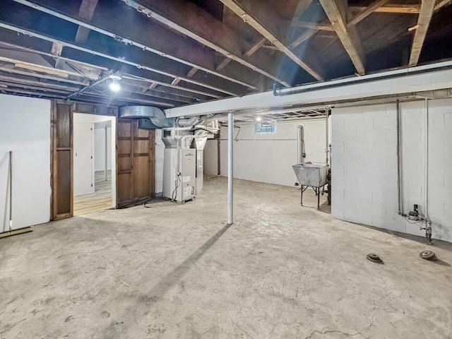 2209 Summit Ave, Racine, WI 53404 - below grade area with heating unit and a sink