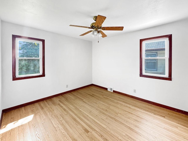 2209 Summit Ave, Racine, WI 53404 - spare room featuring baseboards, light wood-type flooring, and a ceiling fan