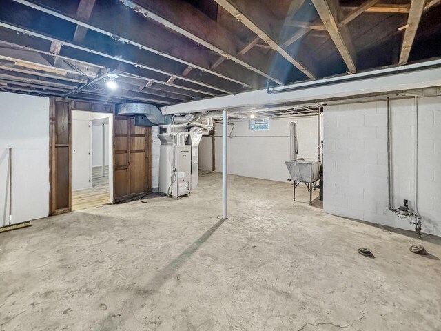 2209 Summit Ave, Racine, WI 53404 - basement with heating unit and a sink