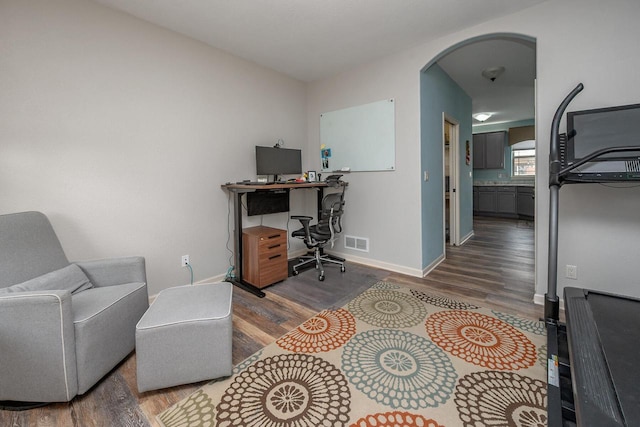 1712 Galena Dr, Port Washington, WI 53074 - office area with arched walkways, wood finished floors, and baseboards