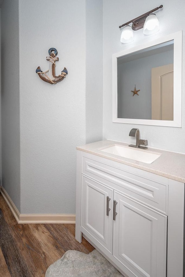 1712 Galena Dr, Port Washington, WI 53074 - bathroom with wood finished floors, vanity, and baseboards