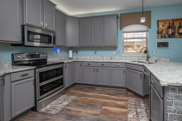 1712 Galena Dr, Port Washington, WI 53074 - kitchen with appliances with stainless steel finishes, gray cabinets, a sink, a peninsula, and dark wood-style flooring