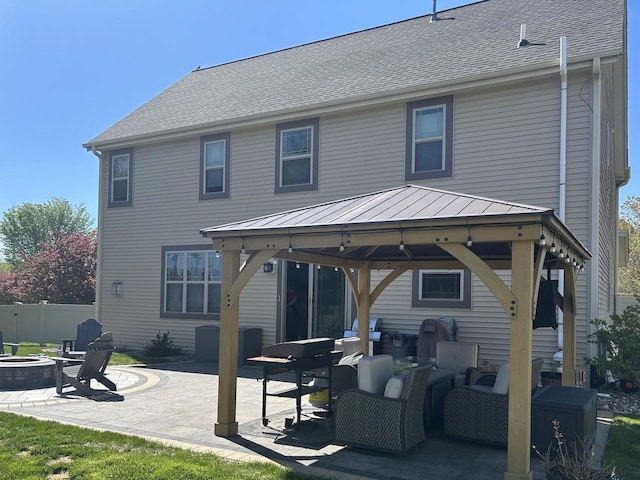 1712 Galena Dr, Port Washington, WI 53074 - back of house featuring a gazebo, an outdoor fire pit, a patio, a standing seam roof, and metal roof