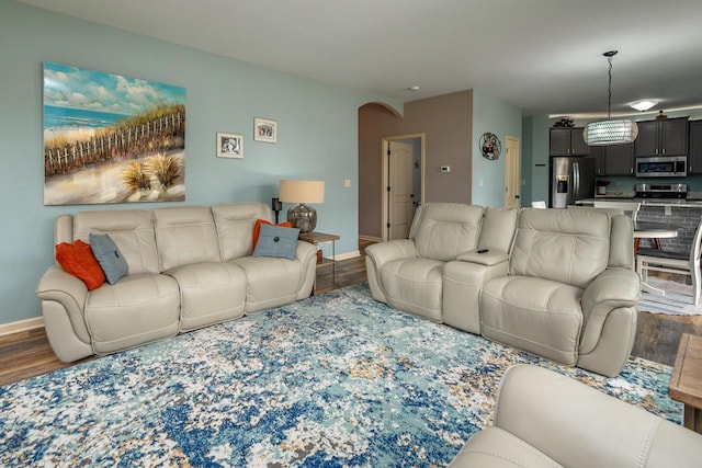 1712 Galena Dr, Port Washington, WI 53074 - living room with wood finished floors, baseboards, and arched walkways