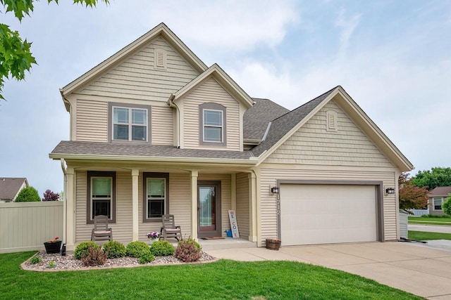 1712 Galena Dr, Port Washington, WI 53074 - view of front of home with concrete driveway, a porch, an attached garage, and roof with shingles