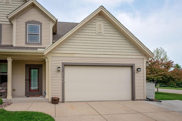 1712 Galena Dr, Port Washington, WI 53074 - view of front of house featuring concrete driveway, a shingled roof, and an attached garage