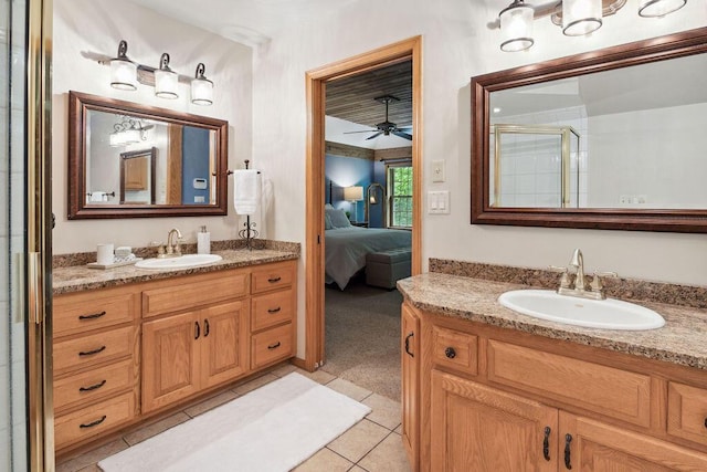 936 Broken Bow Ct, Delafield, WI 53018 - ensuite bathroom with two vanities, ceiling fan, a shower stall, and tile patterned flooring
