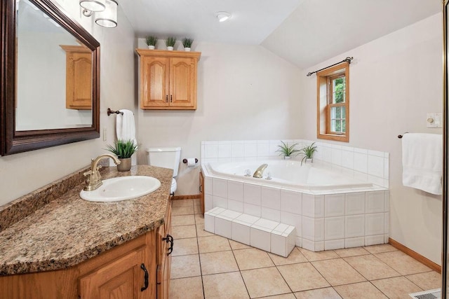 936 Broken Bow Ct, Delafield, WI 53018 - bathroom featuring vanity, a bath, baseboards, vaulted ceiling, and tile patterned flooring