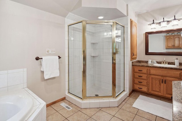 936 Broken Bow Ct, Delafield, WI 53018 - full bathroom featuring a shower stall, vanity, tile patterned flooring, and a garden tub