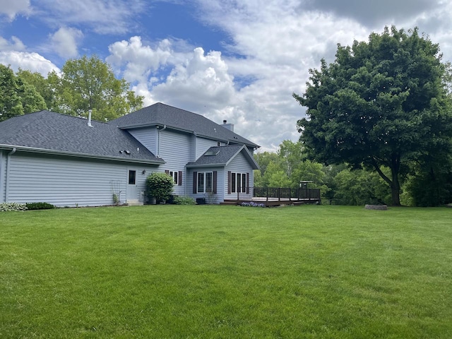 936 Broken Bow Ct, Delafield, WI 53018 - rear view of property featuring a lawn, a deck, and roof with shingles