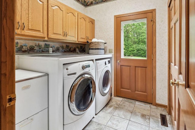 936 Broken Bow Ct, Delafield, WI 53018 - washroom with washer and dryer, cabinet space, and wallpapered walls