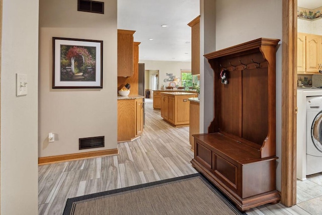 936 Broken Bow Ct, Delafield, WI 53018 - corridor with light wood finished floors, washer / clothes dryer, baseboards, and recessed lighting