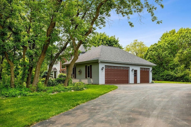 936 Broken Bow Ct, Delafield, WI 53018 - view of property exterior featuring a yard, asphalt driveway, roof with shingles, and an attached garage
