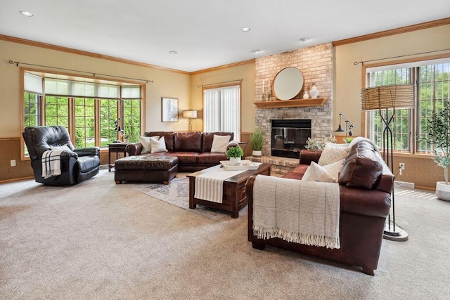 936 Broken Bow Ct, Delafield, WI 53018 - carpeted living room featuring plenty of natural light, a fireplace, ornamental molding, recessed lighting, and baseboards