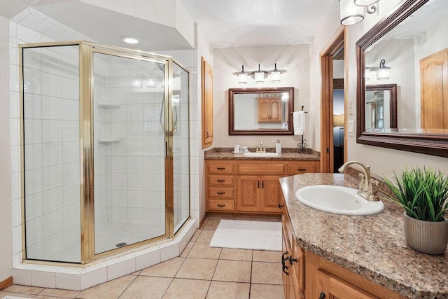 936 Broken Bow Ct, Delafield, WI 53018 - full bathroom featuring a stall shower, two vanities, and tile patterned floors